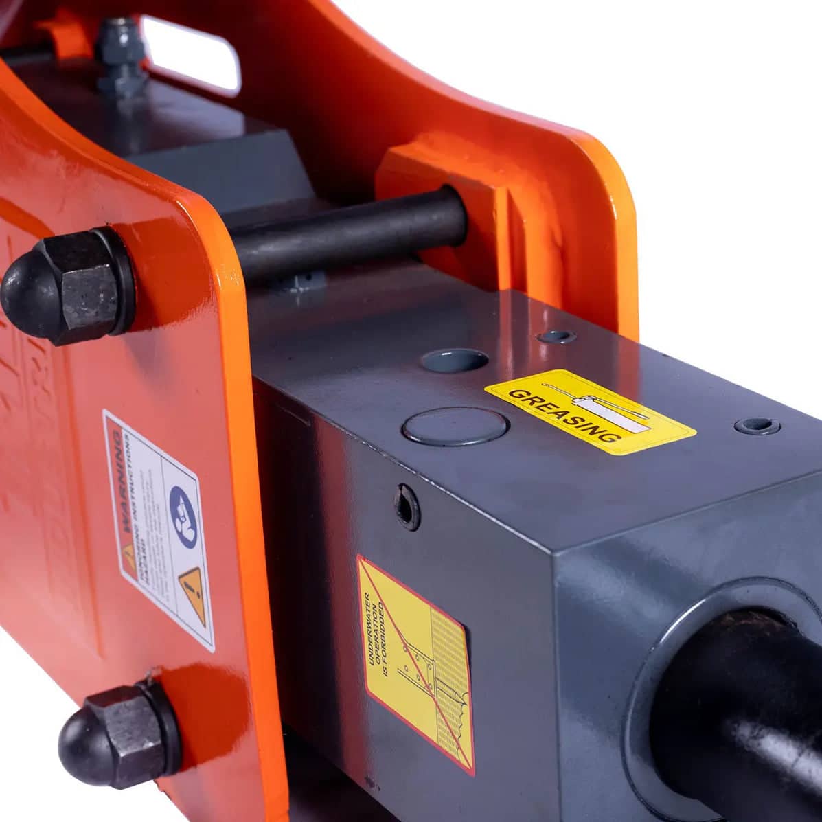 41a45c46-7655-568e-84db-0e63e29d2264jpg - ExcavatorPin Close-up of an industrial hydraulic mechanism with orange protective housing and warning labels (greasing sticker) on a gray metal body.