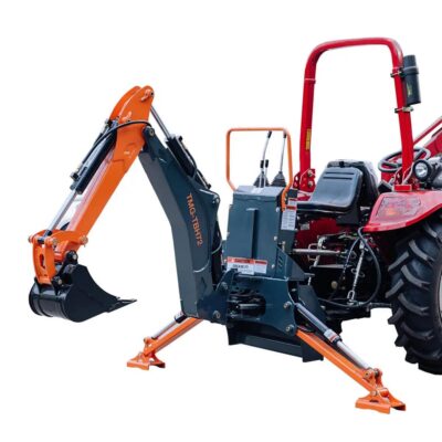 Tractor equipped with a backhoe attachment and stabilizing legs for digging